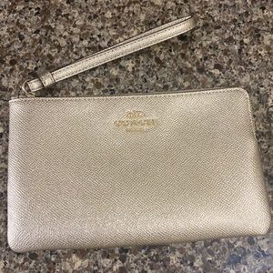 Coach corner zip wristlet.